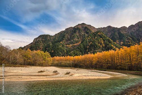 Nature landscape at Kamikochi Japan, autumn foliage season with pond and mountain
