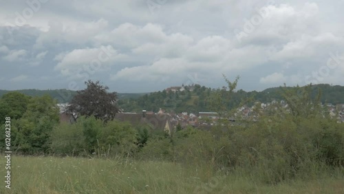 Landscape footage of Heidenheim in southern Germany in August. The pan shot shows the valley with the city Heidenheim an der Brenz, the castle and natural vegetation of the Swabian albs mountains. photo