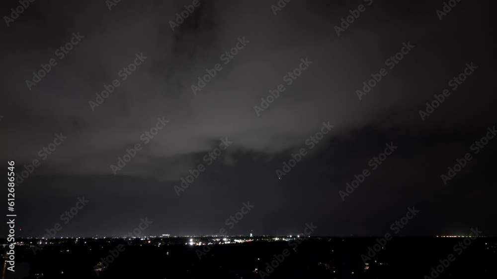 Multiple Quick Lightning Strikes Flash and Light Up The Sky With An Airplane in the Distance During A Thunderstorm In Tampa, Florida. - Aerial Static Wide Multiple Quick Lightning Strikes Flash and Light Up The Sky With An Airplane in the Distance During A Thunderstorm In Tampa, Florida. - Aerial Static Wide