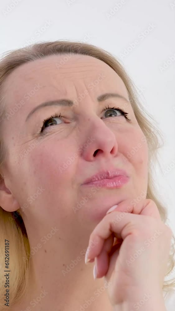 woman standing and thinking an idea pointing finger up over isolated background.