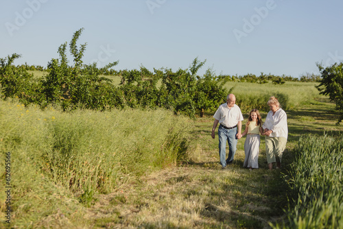 elderly people farmers in the field of wheat a walk in nature