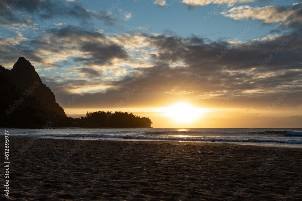 Sunset on Sandy Beach with Partial Cloud in Kauai Hawaii