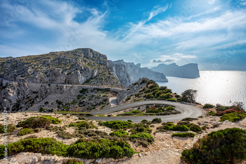 Winding narrow road to lighthouse on the cliff of Cap Formentor. Balearic Islands Mallorca Spain. Vacation concept. One of the most visited landmark in Mallorca photo