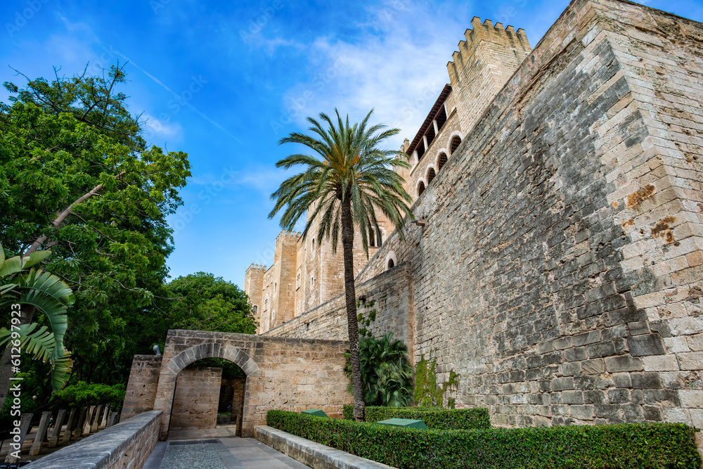Royal Palace of La Almudaina next to cathedral La Seu. One of the official residences of the Spanish royal family. City Palma de Mallorca. Balearic Islands Spain. Travel agency vacation concept.