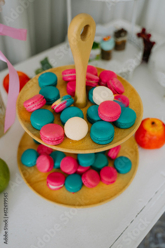 colorful french macaroons from the plate.