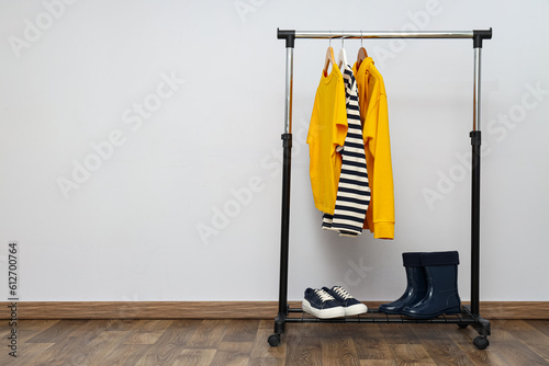 Wardrobe rack with different clothes, concept of different clothes © Atlas