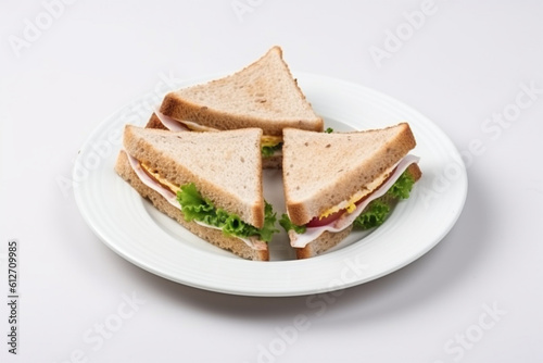a plate of sandwiches on a white background