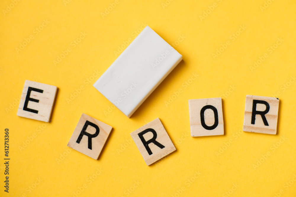 A word made of letters - error and eraser on a yellow background. A word made of letters - error and eraser on a yellow background.