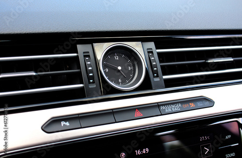 Clock Inside the Centre Console Interior. Car interior details of chronometer analog clock, dashboard. Luxury car clock close up. 