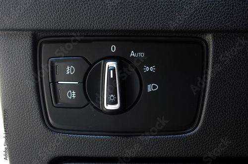 Close up of light control in car. Headlight switch, fog lights, automatic control of switching on and off the car light.