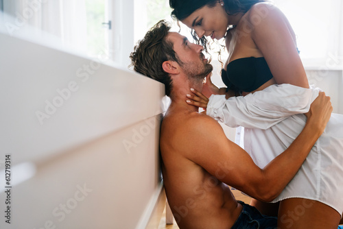 Portrait of beautiful romantic sensual couple enjoying foreplay and intimate moments