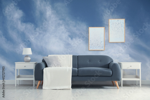 Blue sky with clouds on wallpaper in furnished room. Beautiful interior design © New Africa