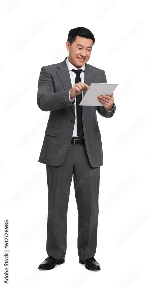 Businessman in suit using tablet on white background Businessman in suit using tablet on white background
