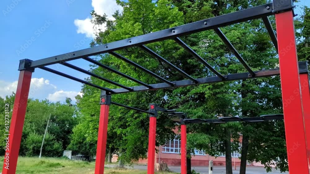 A modern sports ground outdoors. Horizontal bars in the open air. Fitness, sport, exercise, training and heathy lifestyle concept. A modern sports ground outdoors. Horizontal bars in the open air. Fitness, sport, exercise, training and heathy lifestyle concept.