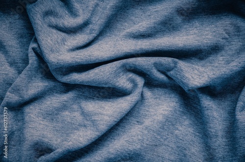 Wrinkled fabric texture. Close-up of soft cotton cloth, may be used as background.