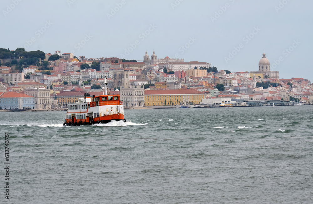 Fototapeta premium Old ferry crossing the water in Lisbon, Portugal