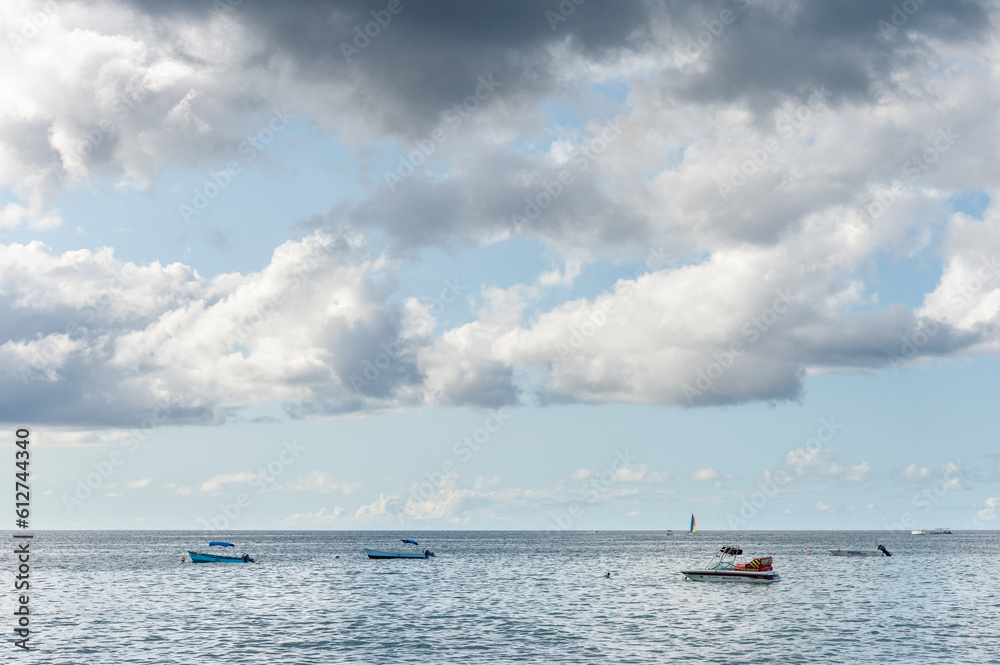 Ocean in Barbados Island with Yacht and Boats. Cloudy Blue Sky. Caribbean Island.
