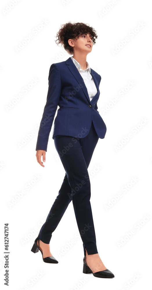 Beautiful businesswoman in suit walking on white background Beautiful businesswoman in suit walking on white background