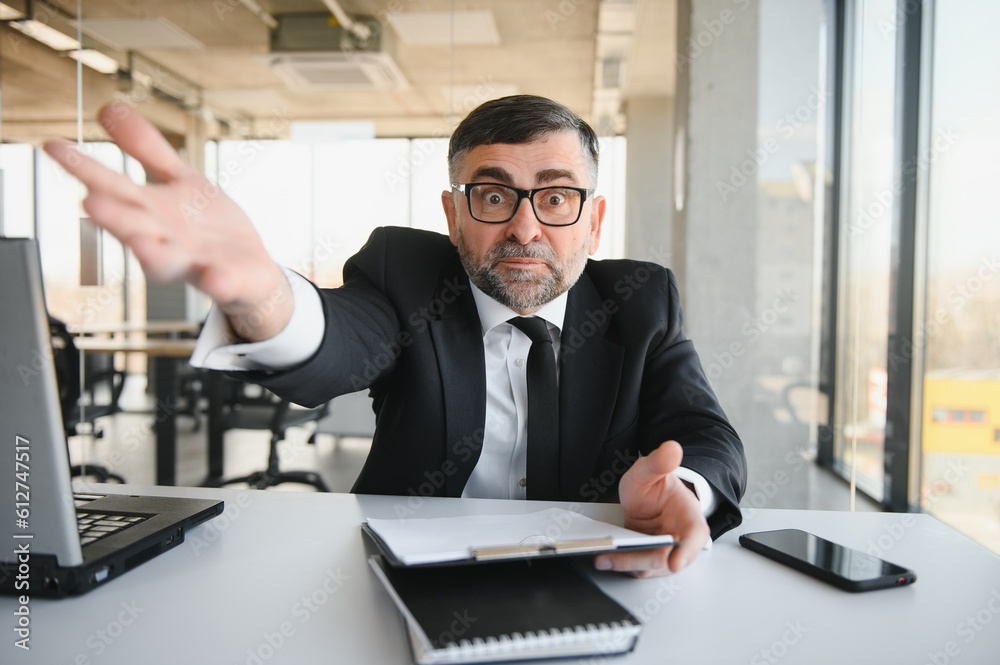 Angry boss behind of office table Angry boss behind of office table