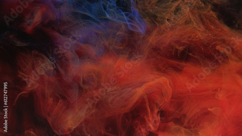 Color smoke texture. Paint water. Fire flame. Hot cold mix. Red blue fume cloud floating on dark black abstract art background.