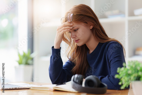 Tableau sur toile Sad teenager studying preparing for exam test in the university library