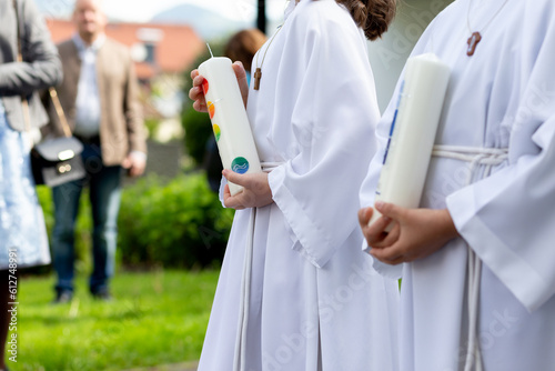 First communion children holding candles