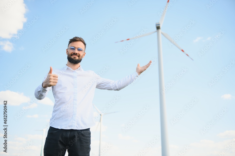 Engineer working at alternative renewable wind energy farm - Sustainable energy industry concept Engineer working at alternative renewable wind energy farm - Sustainable energy industry concept