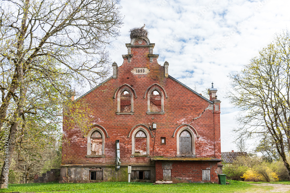 Abandoned red brick Regi manor, Latvia.
