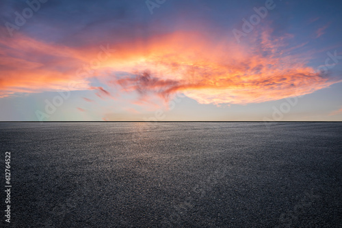 Fototapeta Naklejka Na Ścianę i Meble -  Asphalt road and colorful sky clouds at sunset