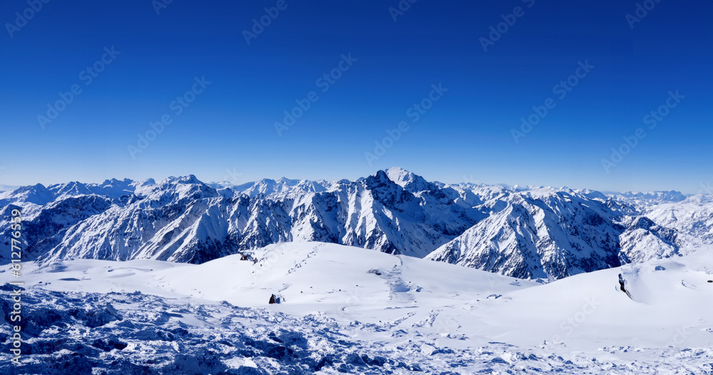 Fototapeta premium Icy Snow Mountains Sunlight Build Wallpaper. Generative AI illustration