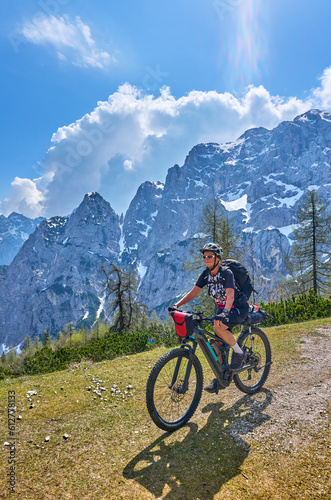 active senior woman on a mountain bike tour in the Julian Alps above Kranska Gora in Slovenia © Uwe