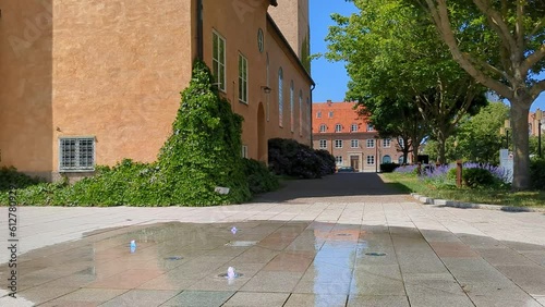 4K 60FPS of Fountain With Water Outside of Modern Church in Southern Sweden Scandinavia photo