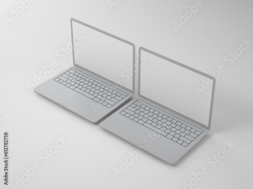 Two open laptops on a light background