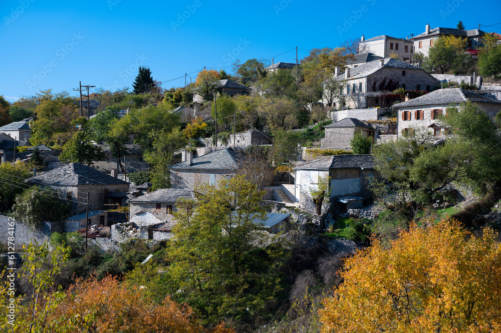 Autumnal landscape showing the stone houses of traditional architecture in the village of Elaphotopos in Zagori of Epirus, Greece