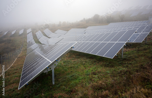Solar Farm panels on a field in northern Greece with mist