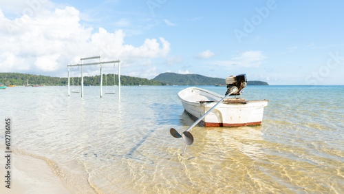 Seascape with a boat and clear water and mountain on the background in daytime   Beautiful island with clear water 