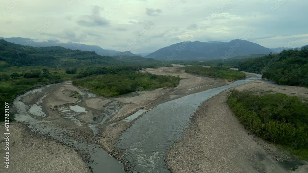 Aerial view of a river flowing through the Andes mountains in Colombia Aerial view of a river flowing through the Andes mountains in Colombia