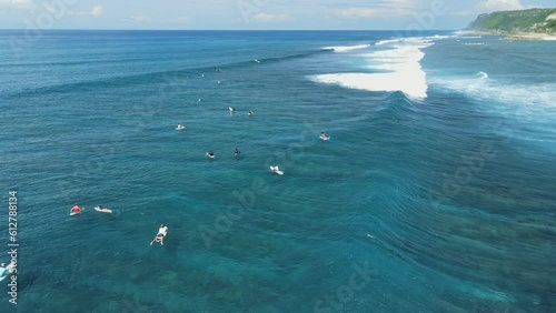 Tropical  ocean with surfing waves and surfers. Aerial view