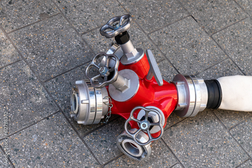 фотографія Fire hose water splitter with valves and connecting flanges