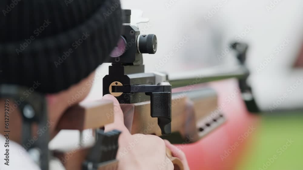 Man shooting at targets with weapon Man shooting at targets with weapon