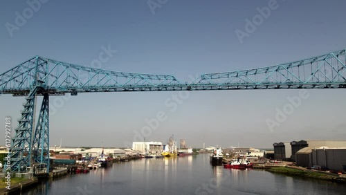 Drone flies back from Transporter Bridge whilst ascending. Shot on a sunny spring morning in Middlesbrough  photo