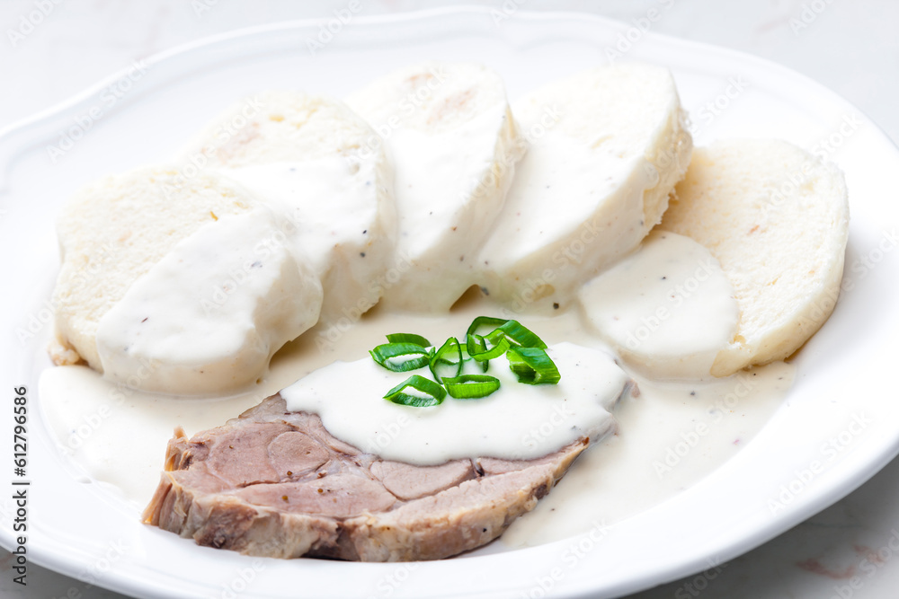 meat with cream sauce and dumplings