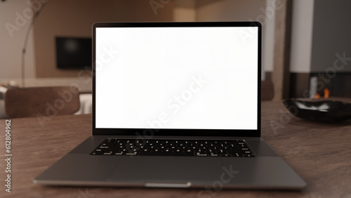 close up of a laptop on a table in a modern living room with transparent screen for content placement like Mockups, Home Office Commercial, Advertising or Infographics.