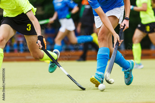 Close up image of attack in field hockey game.