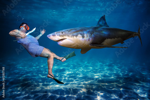 A diver in a retro swimsuit is ready fighting with shark under water