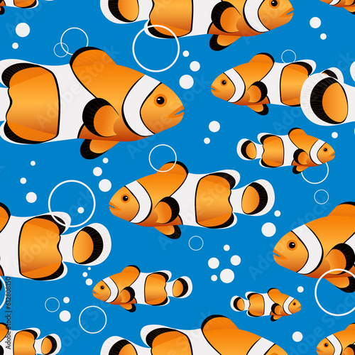 Clown fish. Marine life in the sea and ocean. Beautiful fish swim on a blue background creating a seamless cartoon pattern for fashion fabrics. 