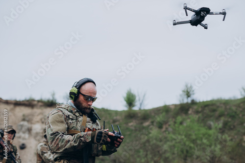 Ukrainian militarymen operating civilian drone photo