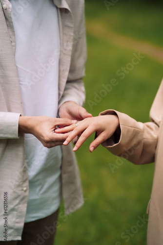 bride and groom Wears wedding rings