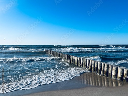 Blue seascape, waves on the sea, sandy coastline, empty beach