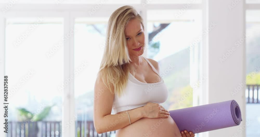 Pregnant woman, portrait and smile for yoga, health and wellness in exercise, workout or training at gym. Happy female yogi in maternity holding stomach with mat and smiling for fitness or pregnancy Pregnant woman, portrait and smile for yoga, health and wellness in exercise, workout or training at gym. Happy female yogi in maternity holding stomach with mat and smiling for fitness or pregnancy